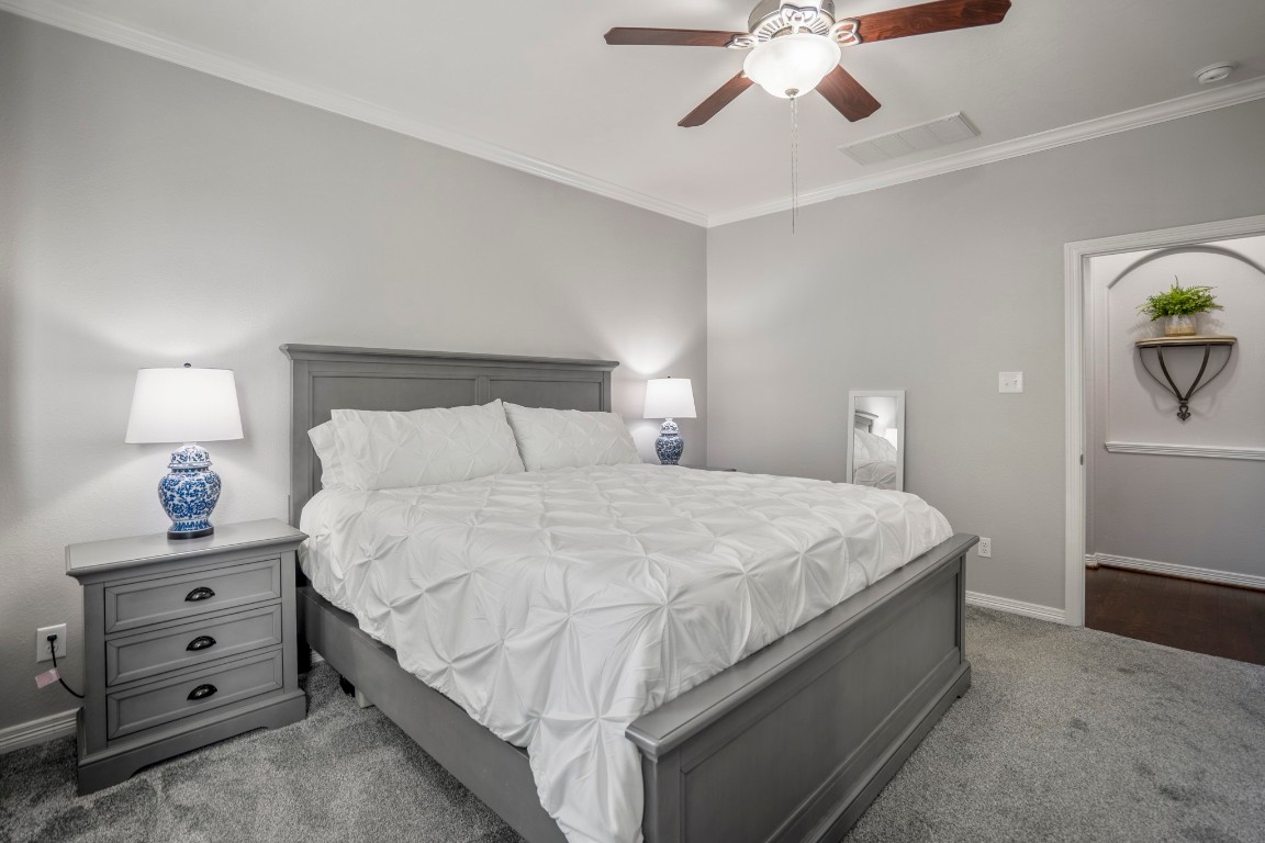 27135 Cottage Stream Lane Fulshear, TX 77441 - Photo 19 of 42 Spacious primary suite with neutral tones and direct access to the ensuite bath for added comfort and convenience.