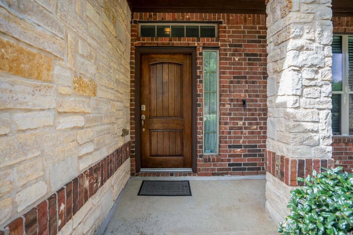 27135 Cottage Stream Lane Fulshear, TX 77441 - Photo 3 of 42 Charming covered front porch - perfect for morning coffee or evening relaxation.