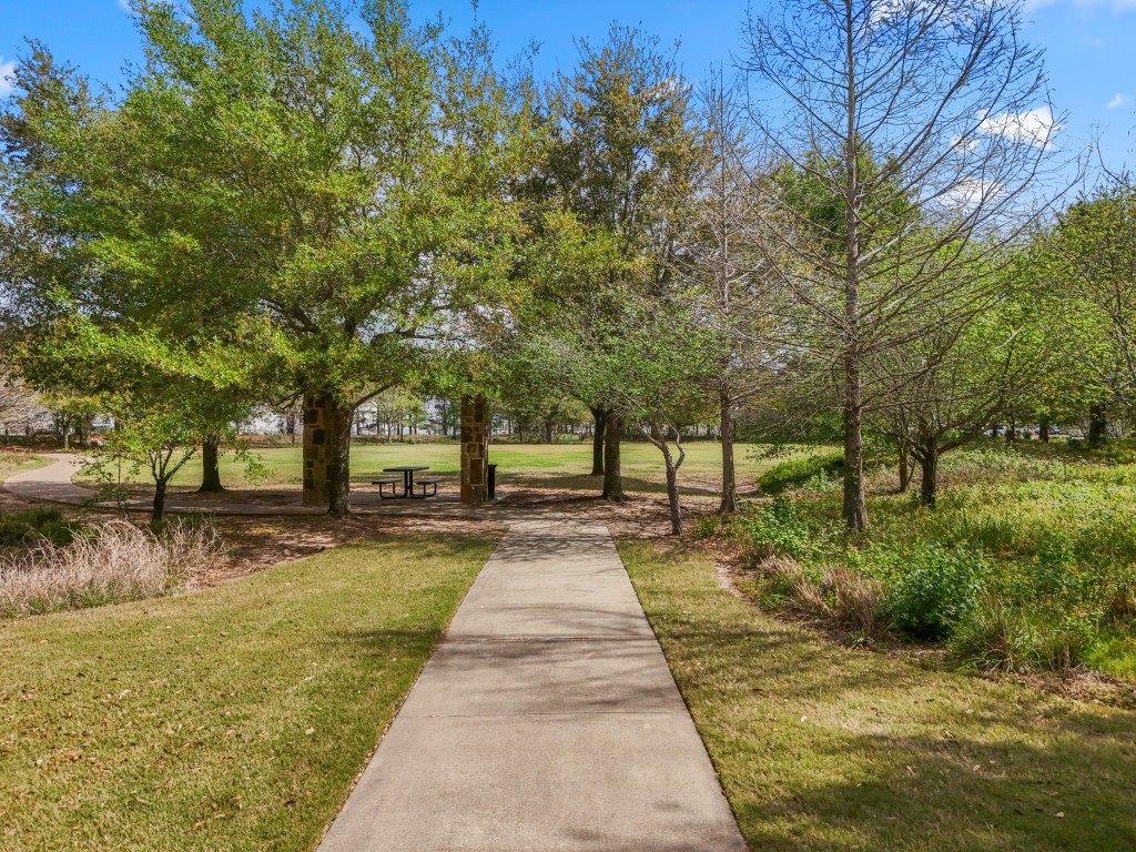 27135 Cottage Stream Lane Fulshear, TX 77441 - Photo 36 of 42 Enjoy nearby green space (across the street) and unwind in nearby green space/park featuring scenic walking paths and beautiful mature trees.