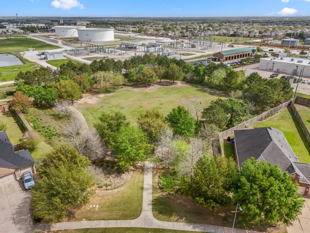 27135 Cottage Stream Lane Fulshear, TX 77441 - Photo 37 of 42 Aerial view of nearby green space with walking trails, picnic tables and beautiful surroundings across the street.