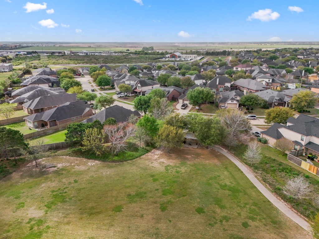 27135 Cottage Stream Lane Fulshear, TX 77441 - Photo 38 of 42 Aerial view showcasing the surrounding neighborhood and nearby green space.