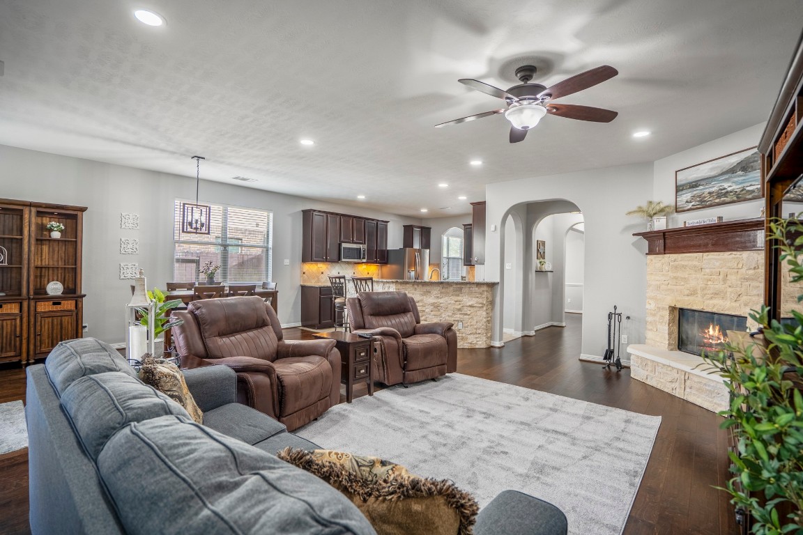 27135 Cottage Stream Lane Fulshear, TX 77441 - Photo 7 of 42 Bright and open living space perfect for relaxing or entertaining seamlessly connected to the kitchen.