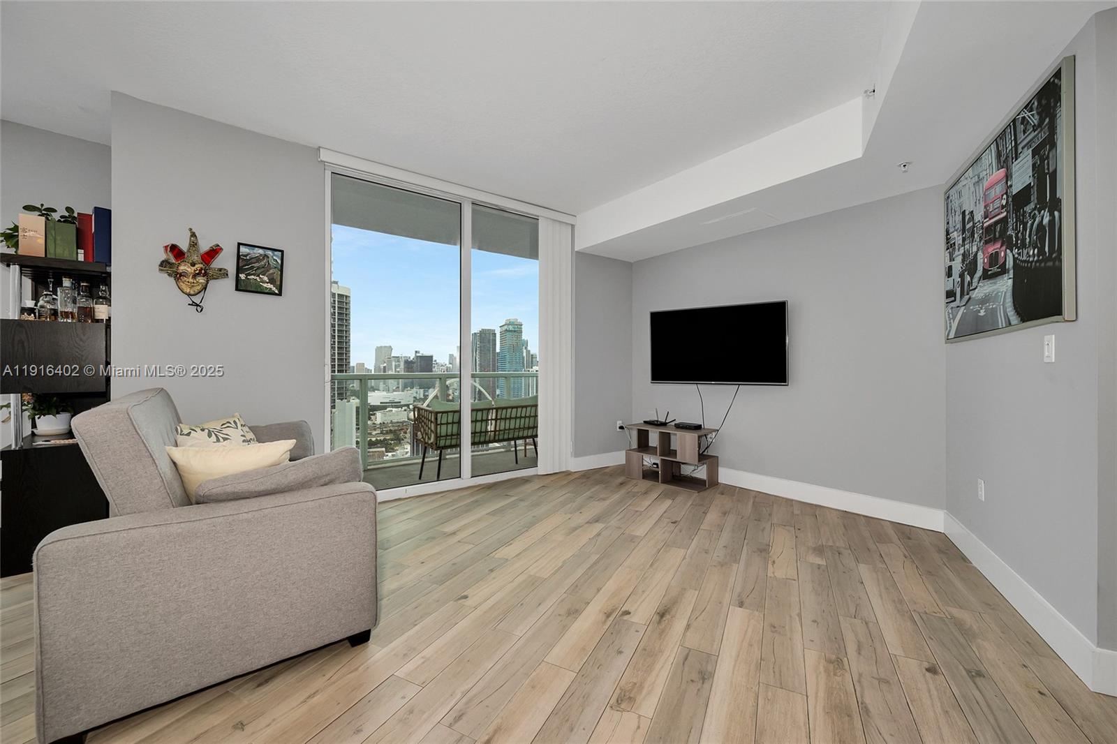 1900 North Bayshore Drive, Unit 4019 Miami, FL 33132 - Photo 11 of 31 a living room with furniture and a flat screen tv