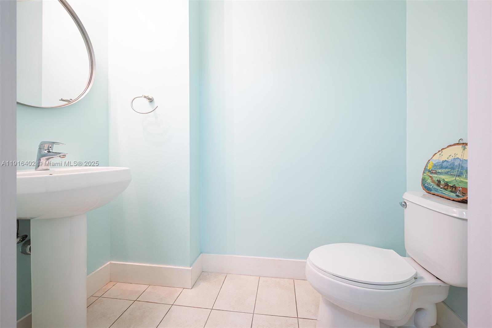 1900 North Bayshore Drive, Unit 4019 Miami, FL 33132 - Photo 13 of 31 a bathroom with a sink toilet and a mirror