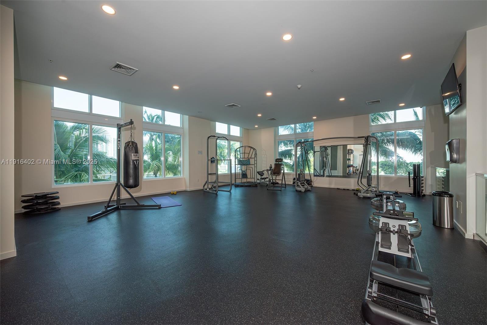 1900 North Bayshore Drive, Unit 4019 Miami, FL 33132 - Photo 30 of 31 a view of a hall with floor to ceiling windows and living room