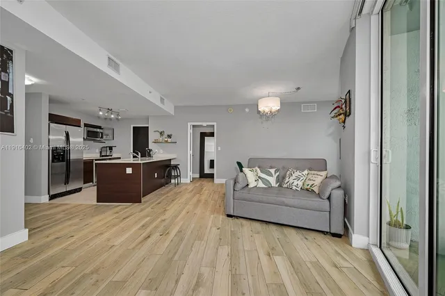 a large room with a bed and cabinets