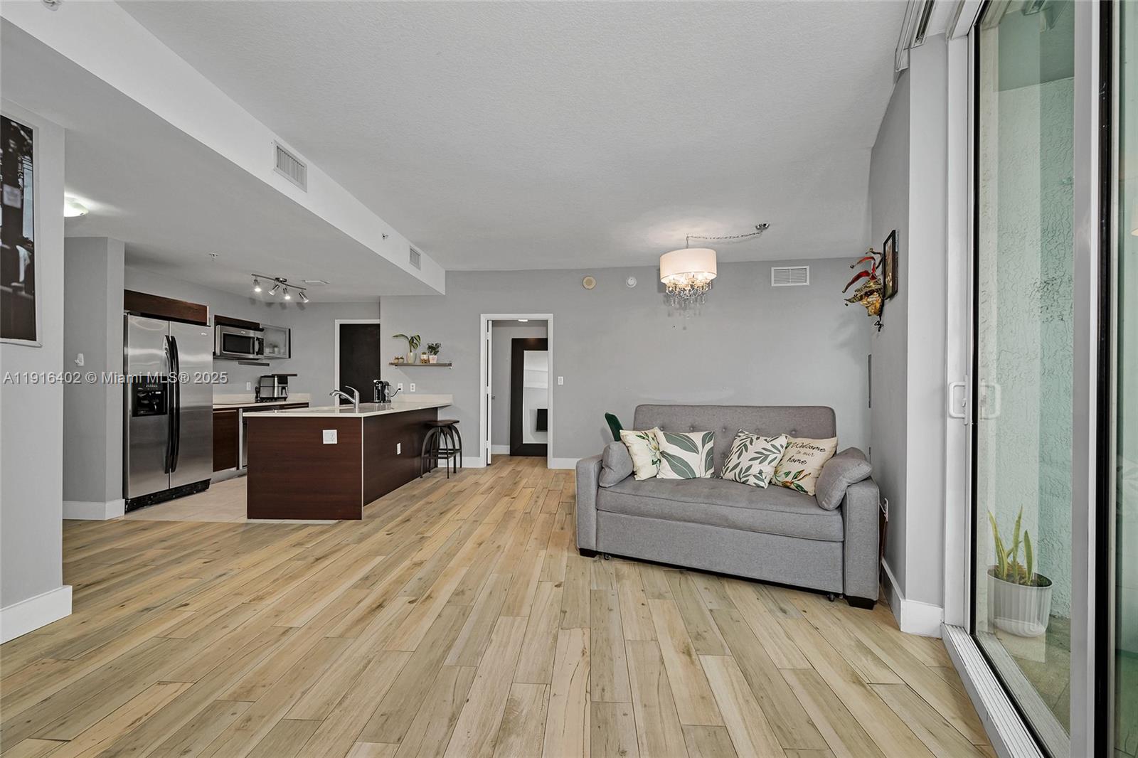 1900 North Bayshore Drive, Unit 4019 Miami, FL 33132 - Photo 3 of 31 a large room with a bed and cabinets