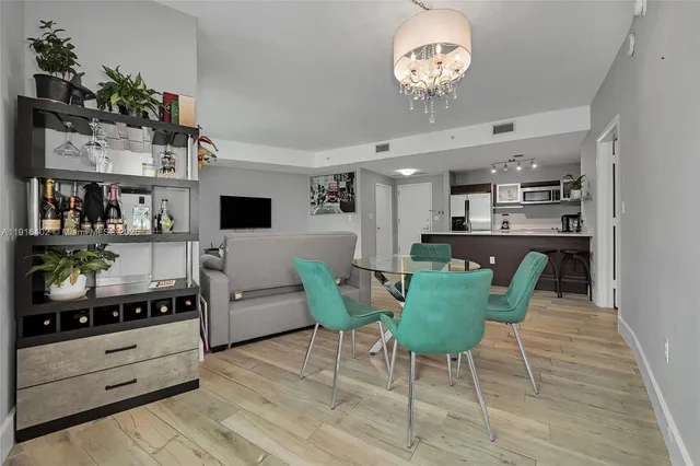 a view of kitchen and dining area with a table chairs