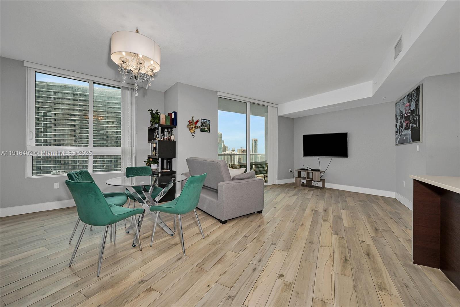 1900 North Bayshore Drive, Unit 4019 Miami, FL 33132 - Photo 10 of 31 a living room with furniture and a flat screen tv