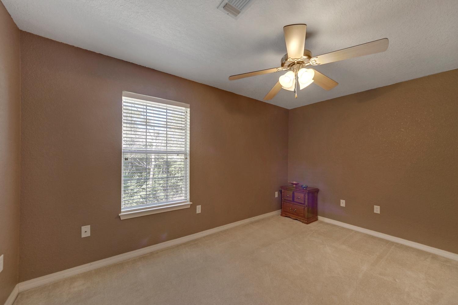 216 East Shipwreck Road Santa Rosa Beach, FL 32459 - Photo 29 of 34 an empty room with windows and fan