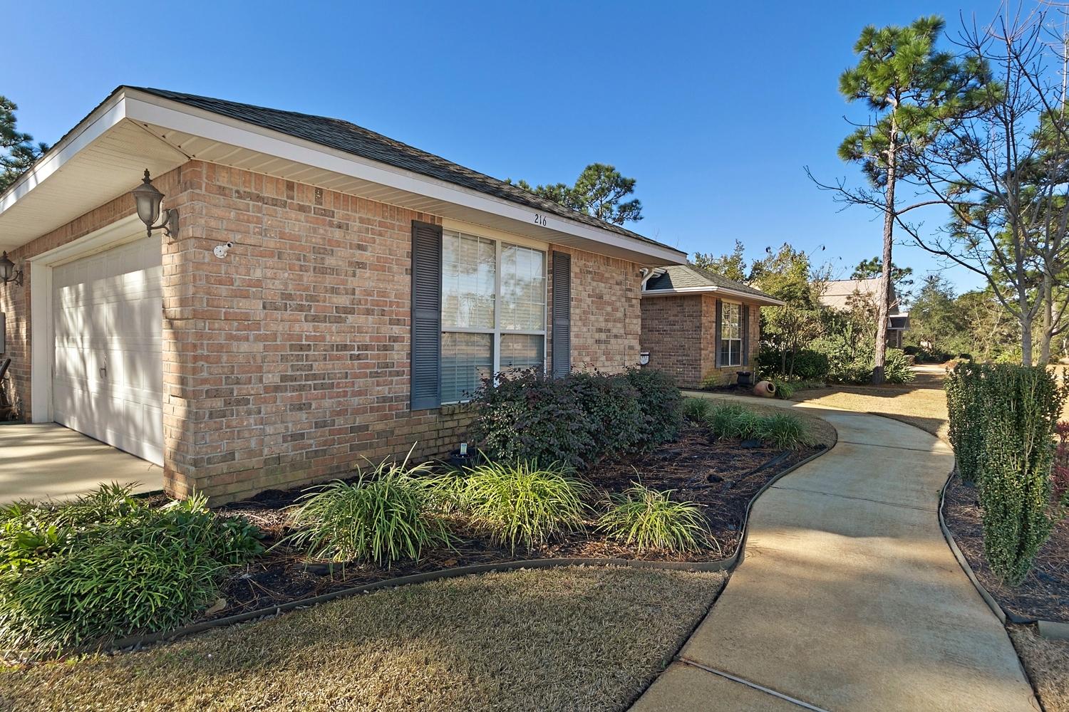 216 East Shipwreck Road Santa Rosa Beach, FL 32459 - Photo 5 of 34 a front view of a house with a yard