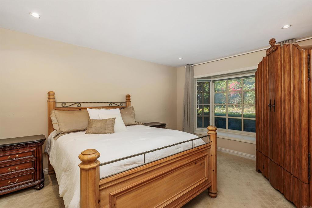 16346 Via Del Alba Rancho Santa Fe, CA 92067 - Photo 20 of 34 a bedroom with a bed and a window