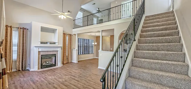 a view of livingroom with window fireplace and hardwood floor