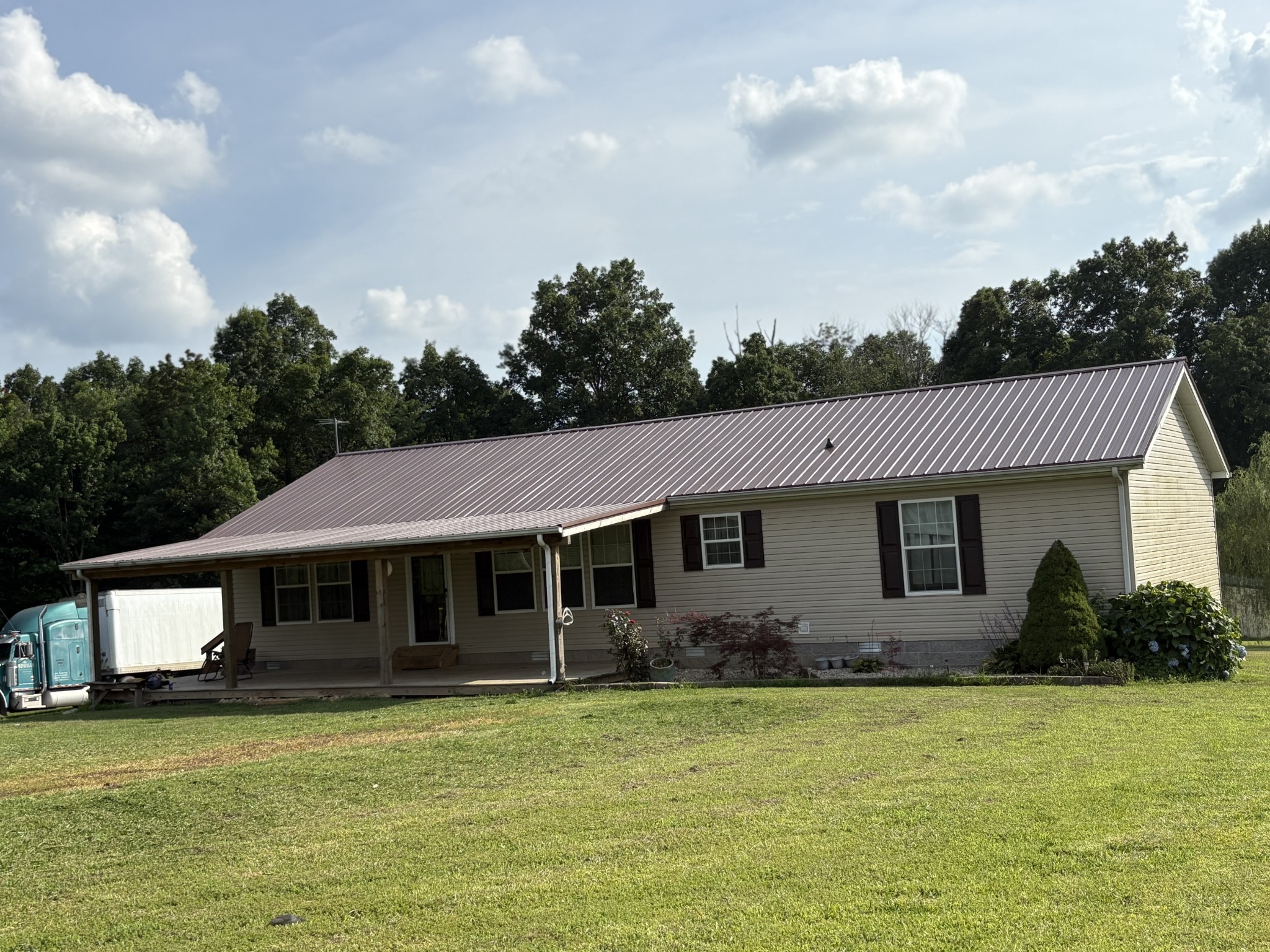 239 Calvert Ridge Road Westmoreland, TN 37186 - Photo 1 of 27 a front view of a house with a garden
