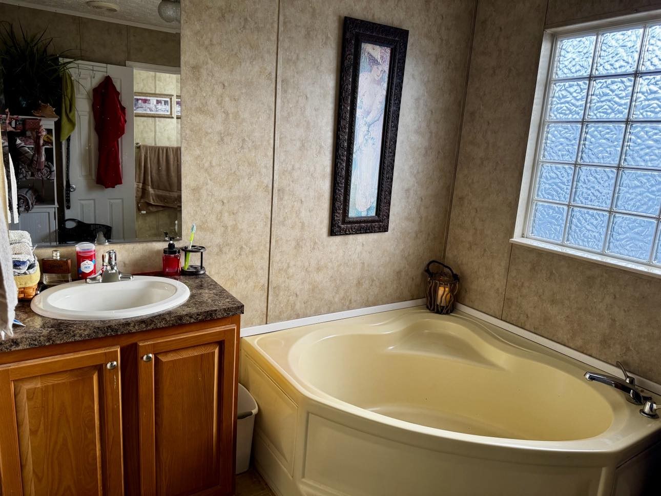 239 Calvert Ridge Road Westmoreland, TN 37186 - Photo 23 of 27 a bathroom with a granite countertop sink and a mirror