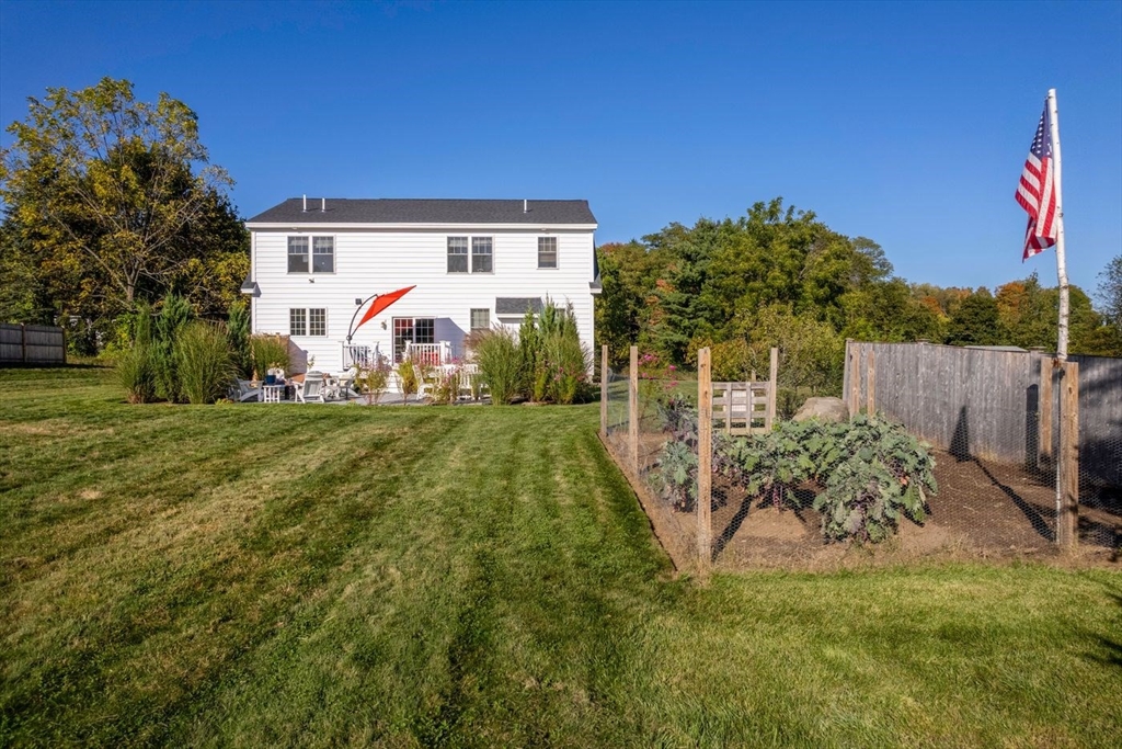 5 John West Road Exeter, NH 03833 - Photo 28 of 33 a front view of a house with garden