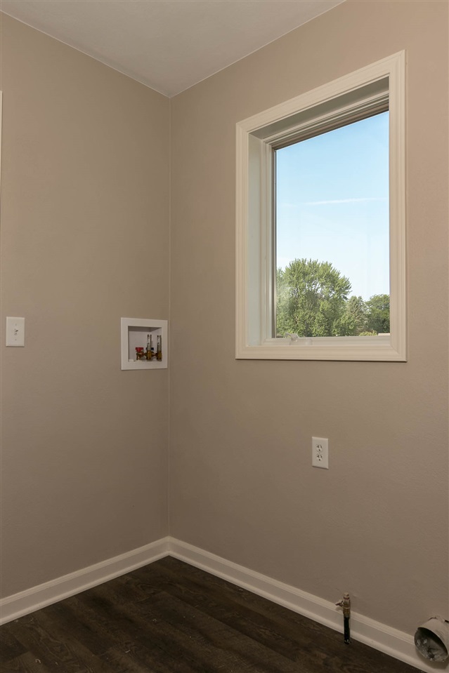 313 East Pershing Road Stillman Valley, IL 61084 - Photo 13 of 21 a view of a small space with wooden floor and a window
