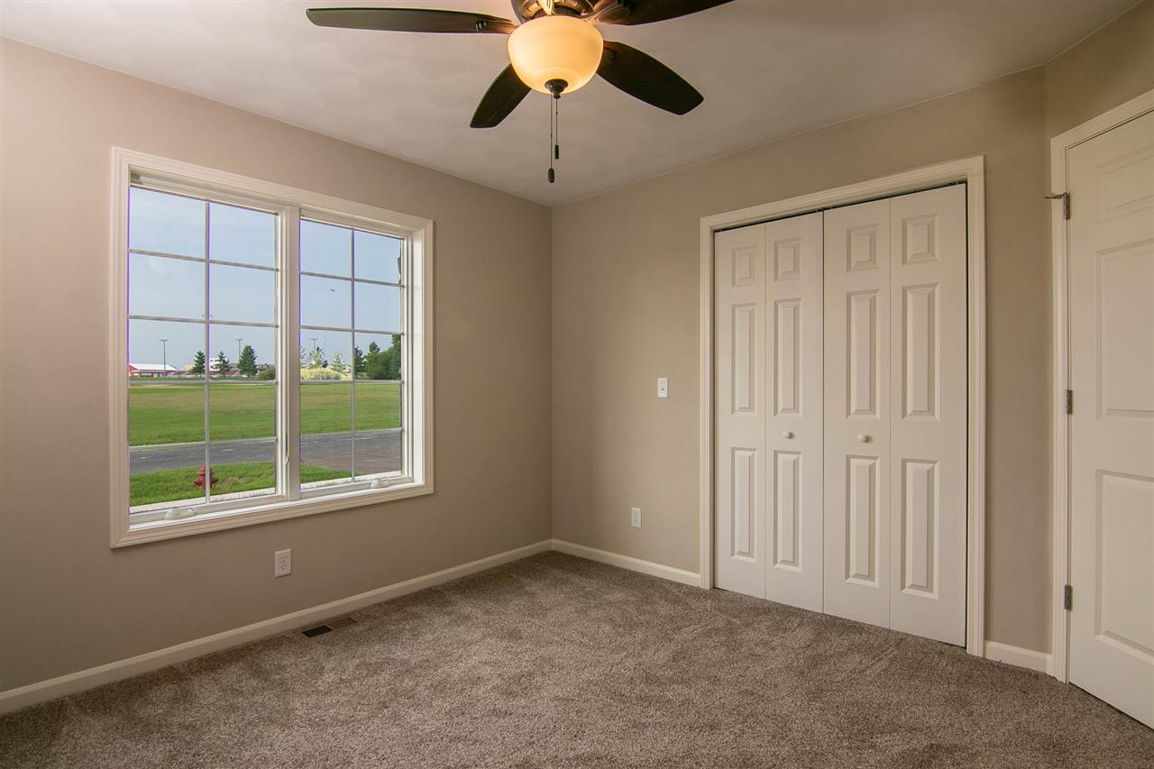 313 East Pershing Road Stillman Valley, IL 61084 - Photo 17 of 21 a view of an empty room with a window