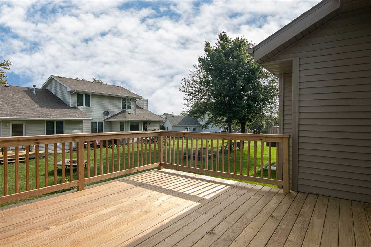 313 East Pershing Road Stillman Valley, IL 61084 - Photo 20 of 21 a view of a wooden deck with a yard