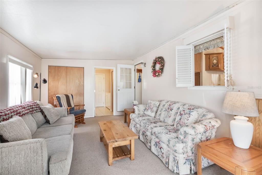 7723 Golf Boulevard Zolfo Springs, FL 33890 - Photo 13 of 24 a living room with furniture and a large window