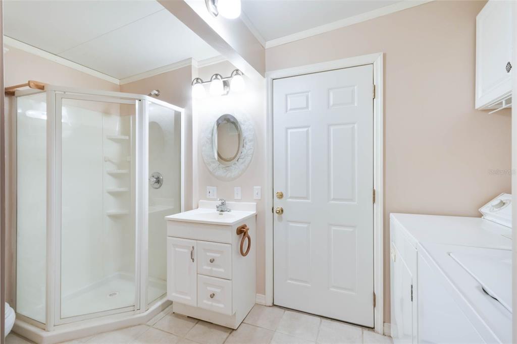 7723 Golf Boulevard Zolfo Springs, FL 33890 - Photo 16 of 24 a bathroom with a sink a toilet and shower