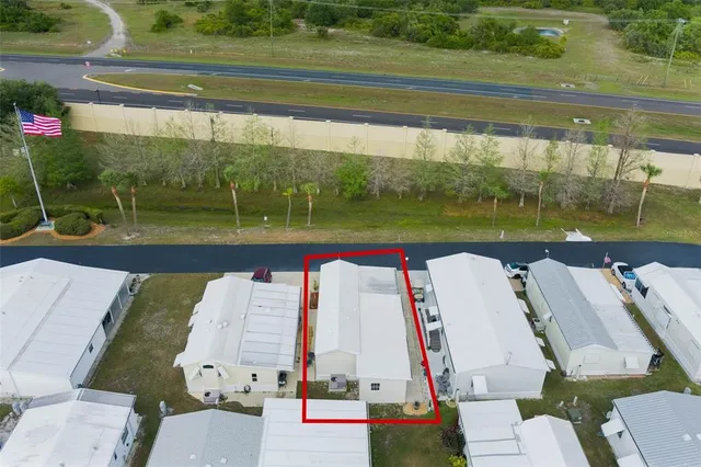 a view of swimming pool with a patio and a yard