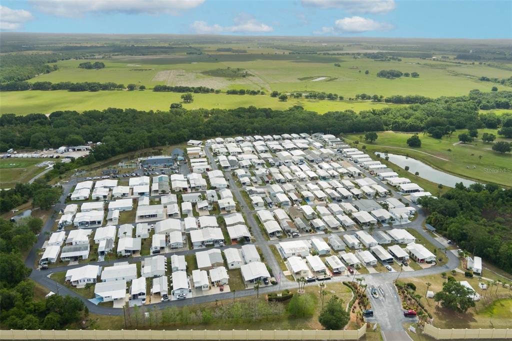 7723 Golf Boulevard Zolfo Springs, FL 33890 - Photo 22 of 24 a view of an ocean with a building in the background