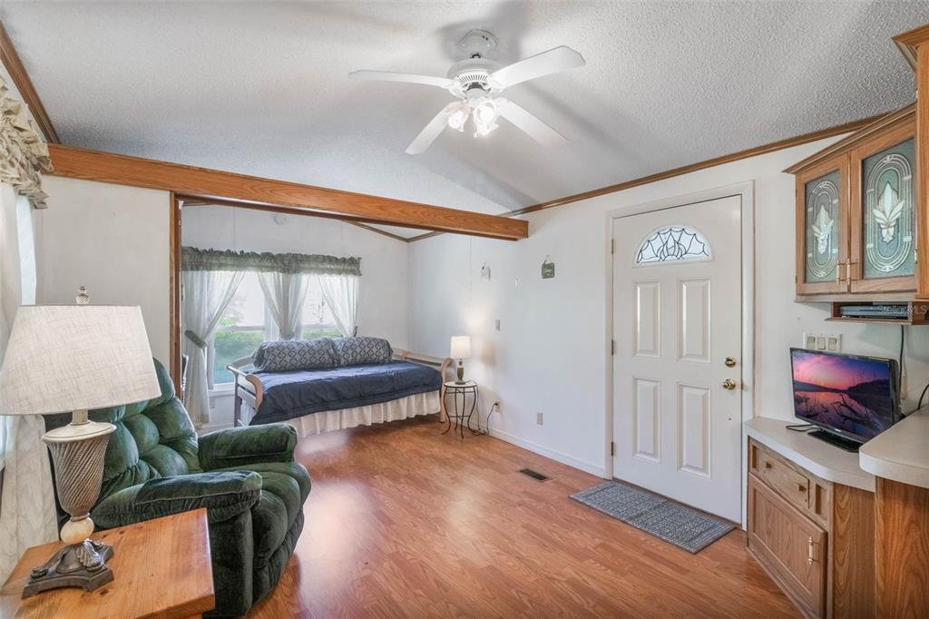 7723 Golf Boulevard Zolfo Springs, FL 33890 - Photo 5 of 24 a living room with furniture and a fireplace