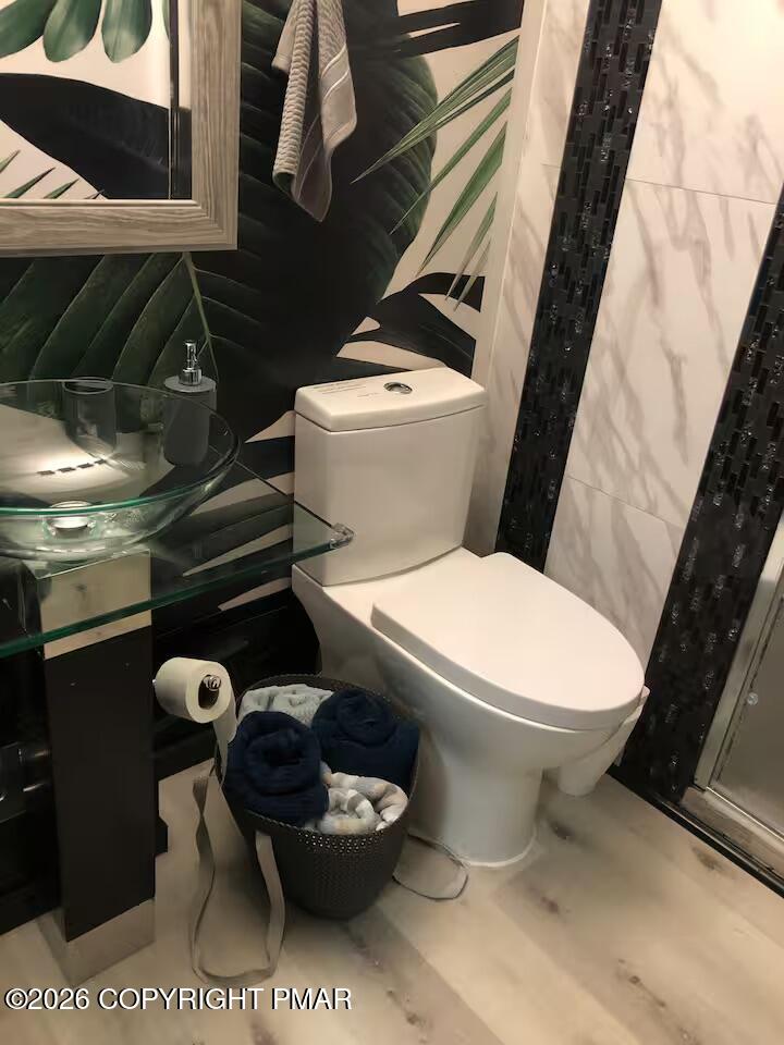 275 Canterbury Road Bushkill, PA 18324 - Photo 11 of 28 a white toilet sitting next to a small bathroom
