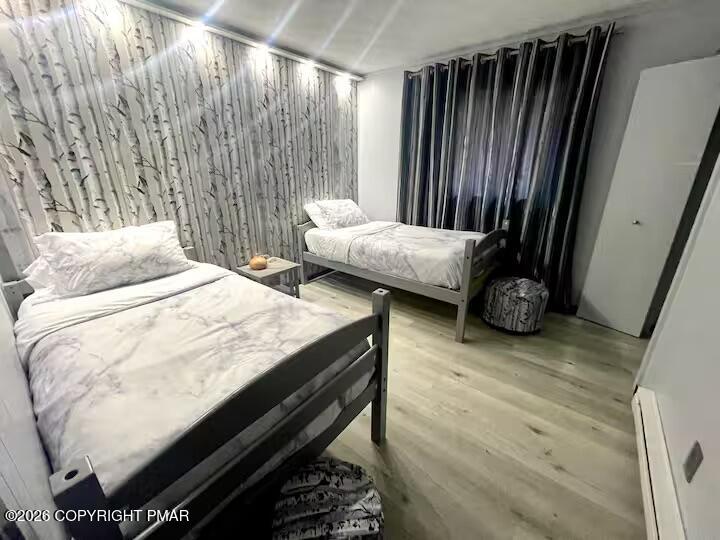 275 Canterbury Road Bushkill, PA 18324 - Photo 13 of 28 a bed sitting in a bedroom next to a window