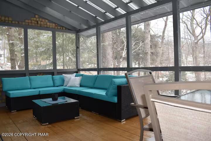 275 Canterbury Road Bushkill, PA 18324 - Photo 26 of 28 a living room with furniture and a floor to ceiling window