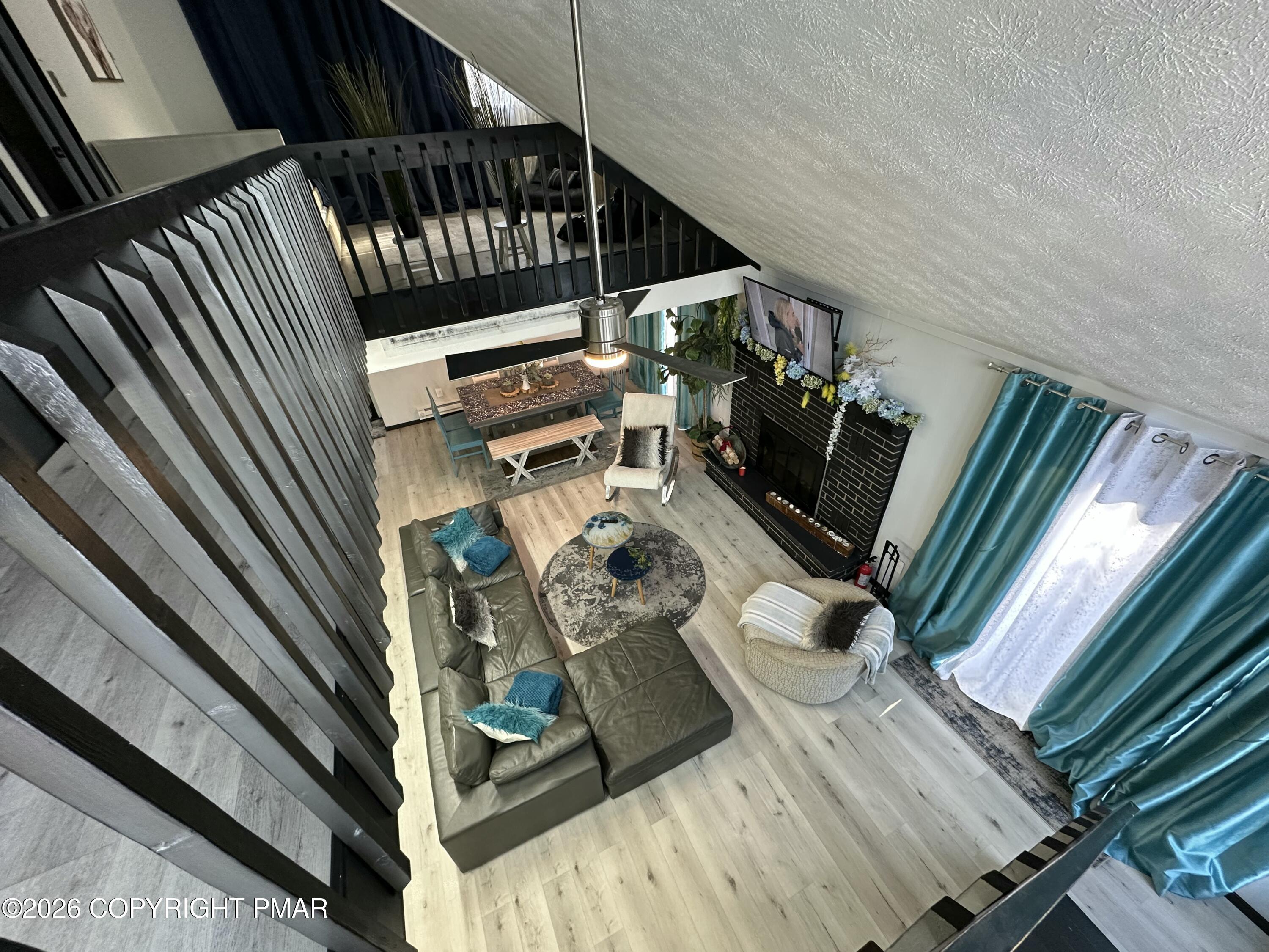 275 Canterbury Road Bushkill, PA 18324 - Photo 6 of 28 a view of stairs and wooden floor