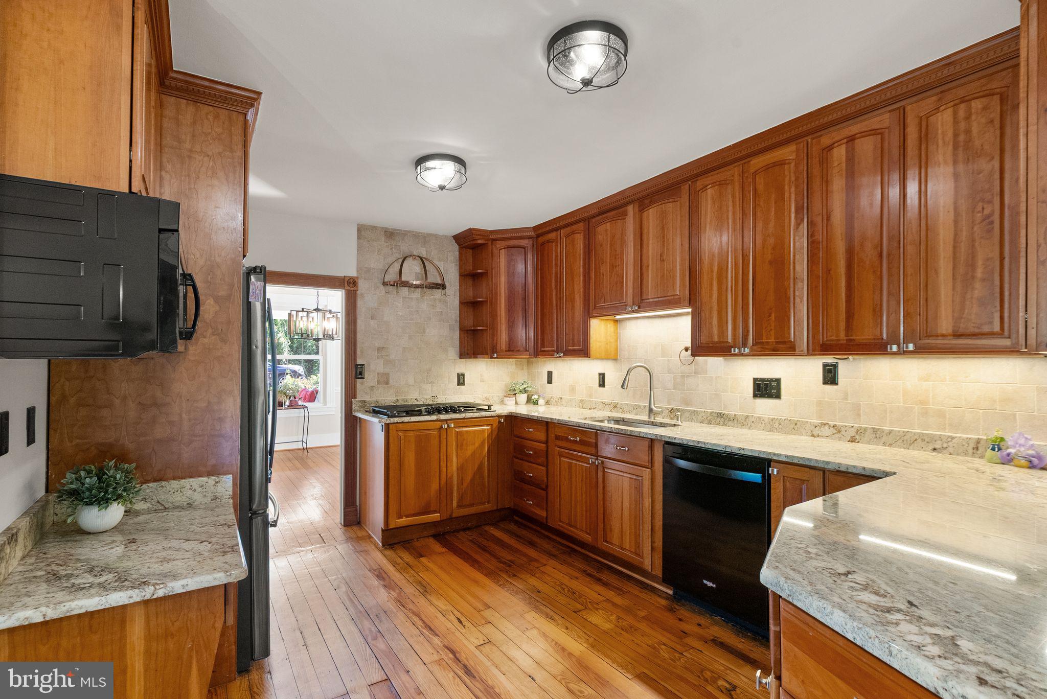 37151 Branchriver Road Purcellville, VA 20132 - Photo 20 of 63 a kitchen with stainless steel appliances granite countertop wooden cabinets a sink and dishwasher