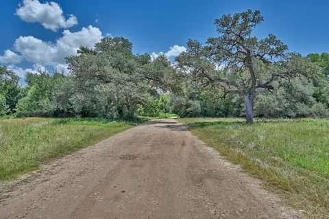 a view of a lake with a big yard