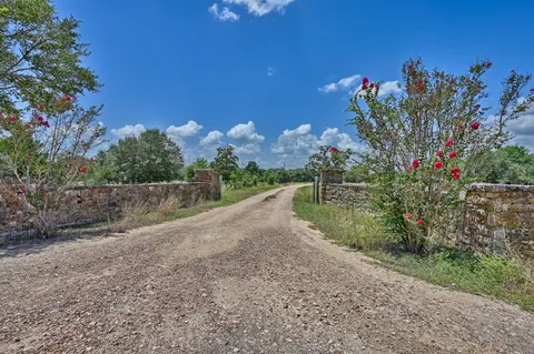 a view of a road with a yard