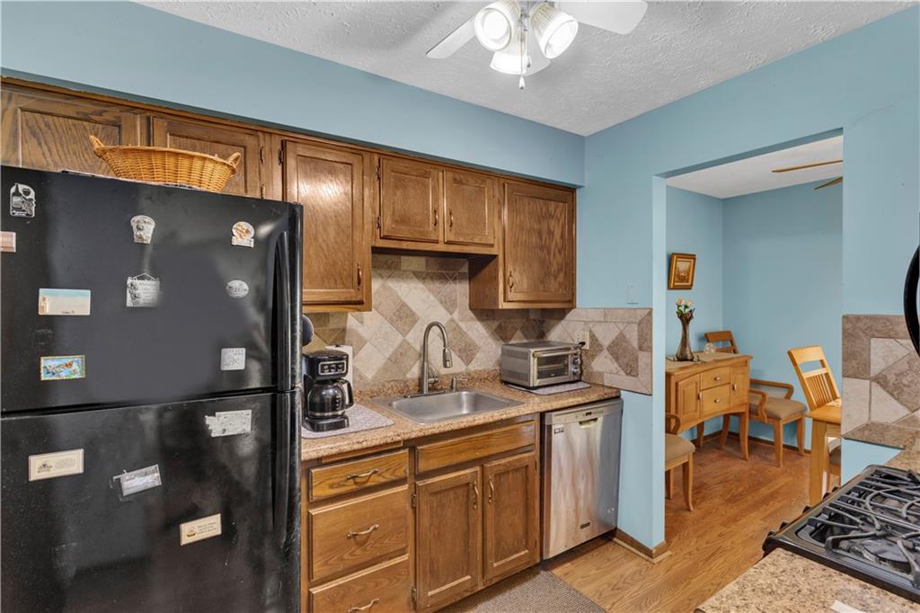 68 New London Lane Oakmont, PA 15139 - Photo 17 of 25 a kitchen with sink refrigerator and cabinets