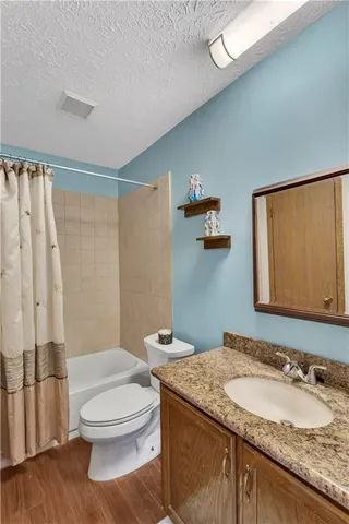 a view of walk in closet with clothes