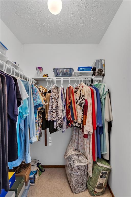 68 New London Lane Oakmont, PA 15139 - Photo 22 of 25 a view of walk in closet with clothes