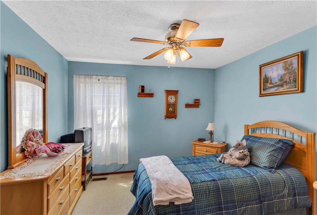 68 New London Lane Oakmont, PA 15139 - Photo 23 of 25 a bedroom with a bed and wooden floor