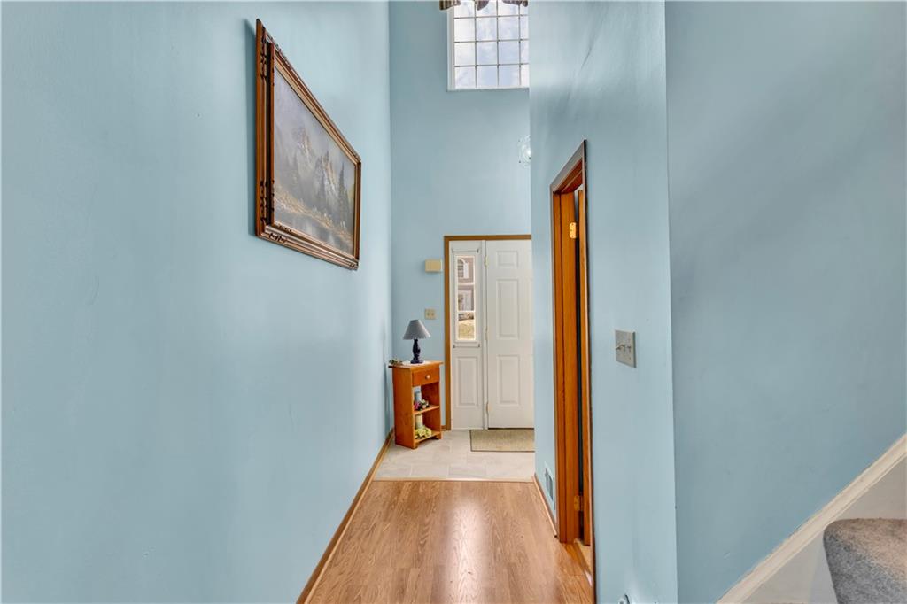 68 New London Lane Oakmont, PA 15139 - Photo 7 of 25 a view of a hallway with wooden floor and staircase