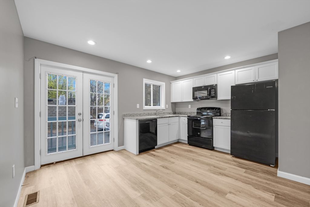 91-93 Alderman Street Springfield, MA 01108 - Photo 5 of 30 a kitchen with a refrigerator and a sink