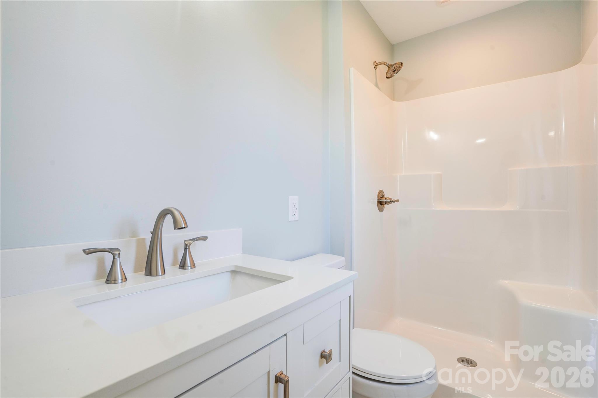 2822 Bettis Road Grover, NC 28073 - Photo 16 of 32 a bathroom with a sink a toilet and shower