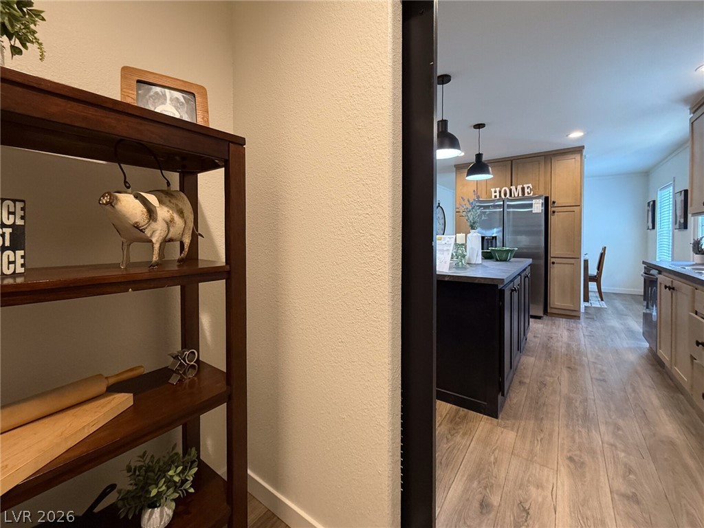 464 Box Canyon Road Alamo, NV 89001 - Photo 16 of 48 Glimpse modern finishes and warm wood floors framing a spacious kitchen layout.