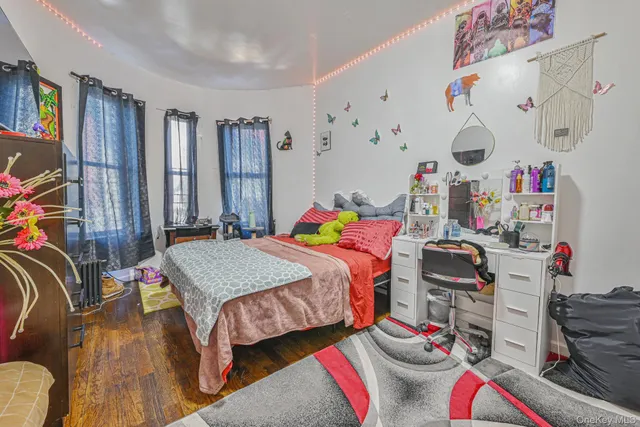 a bedroom that has a bed and a table in it