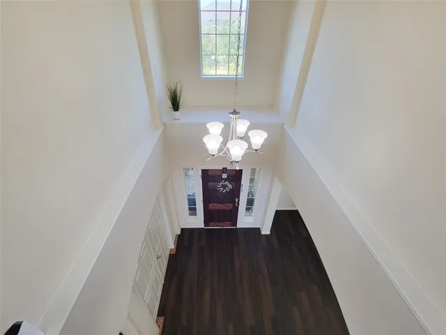 a bathroom with a granite countertop sink a mirror and a vanity