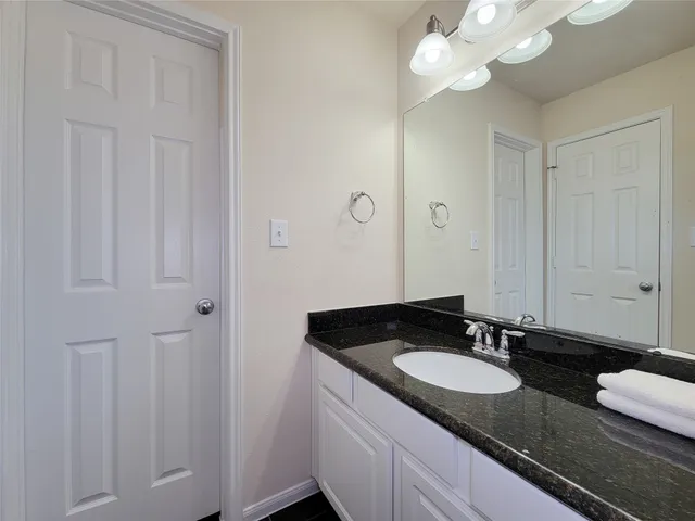 a view of a livingroom with a projector and bedroom