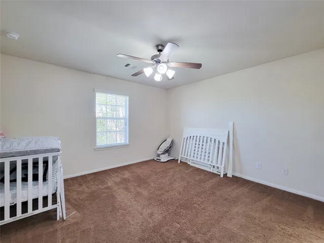 a view of a house with backyard porch and sitting area