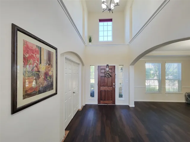 a view of an entryway with wooden floor