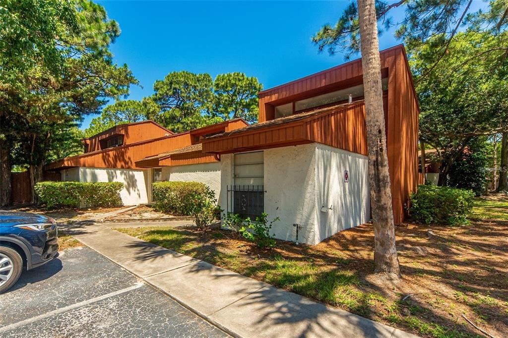 2064 Sunset Point Road, Unit 73 Clearwater, FL 33765 - Photo 5 of 58 a view of a house with backyard and sitting area