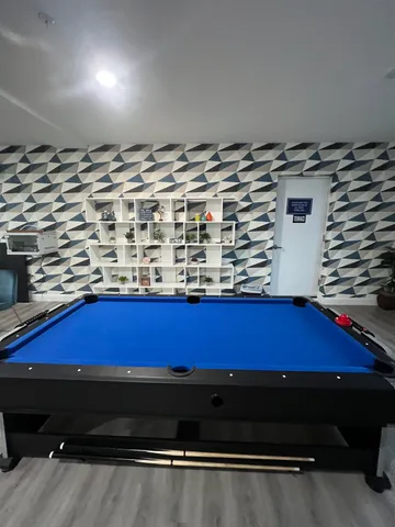 a room with furniture and a book shelf